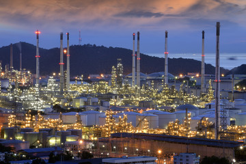 refinery plant at twilight .