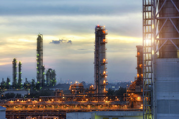 Fototapeta premium Refinery plant at beautiful clouds sunset.