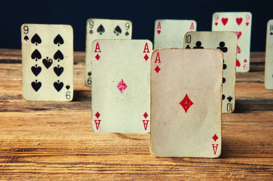 Playing cards on wooden table