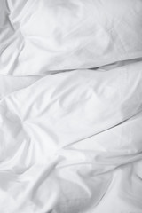 A full page of white creased duvet texture