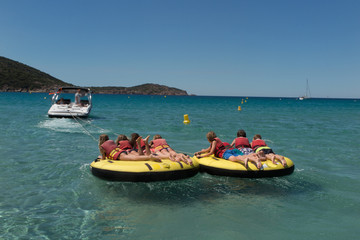 Kids towed together in a watersport buoy