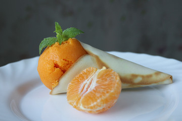 tangerine sorbet in a waffle cone