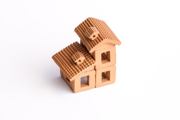 Small toy house assembled with earthenware pieces