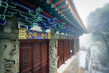 Historic building in fog, at Ngong Ping, Lantau Island, Hong Kon © jonbilous