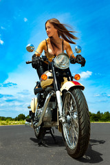 Fototapeta na wymiar biker girl on a motorcycle