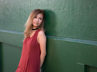 Young Asian woman in city standing