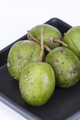 Fresh Hog plum (Wild Mango) on black dish