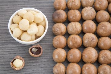 Nuts, macadamia nut on wooden background. From the top view