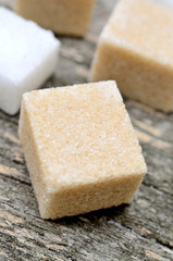 Sugar cubes on wooden table