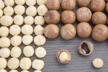 Nuts, macadamia nut on wooden background. From the top view