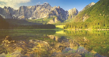 Fototapeta na wymiar mountain lake in the Italian Alps,retro colors, vintage