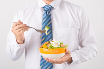 Businessman having a lunch break with salad