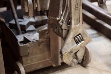 Wrench / Close up of dirty and rusty wrench in the factory.