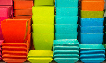 Stack of  colorful plastic containers. They are for sale in Thailand.