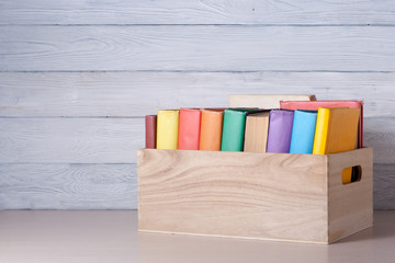 Stack of colorful books on table. Education background. Back to school. Copy space for text.