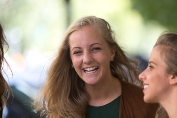 Obraz premium Portrait of pretty laughing blonde girl