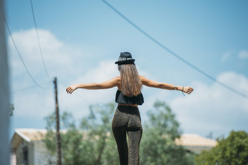 Young woman trying to keep balance
