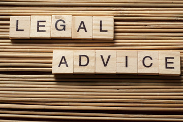 Legal Advice word written on wood block. Wooden ABC.