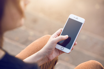 woman uses a smartphone
