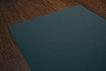 Black paper on wooden desktop
