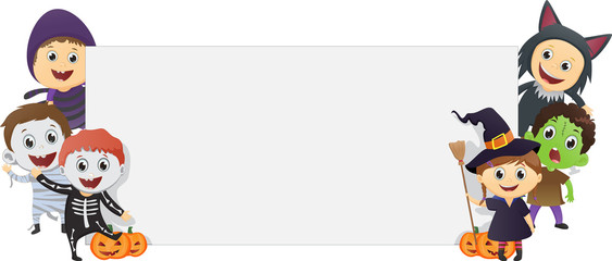 Obraz premium Happy Kids Wearing Halloween Costume with a blank sign