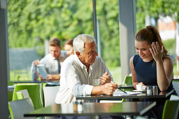 Senior businessman giving consultation to woman