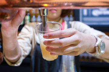 Bartender pouring beer
