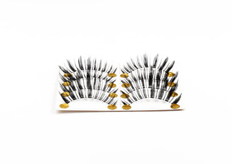 Black false eyelash isolated on white background