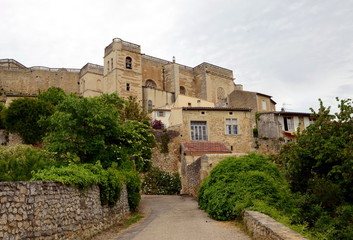 Fototapeta na wymiar View on Grignan buildings' roofs and Grignan castle, France