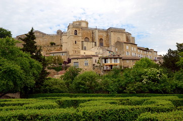 Fototapeta na wymiar View on Grignan buildings' roofs and Grignan castle, France