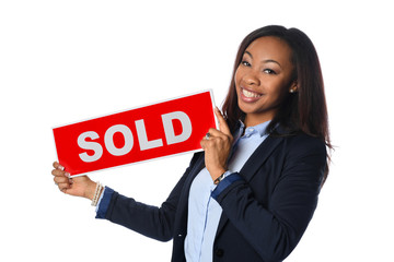 Young Woman Holding Sold Sign