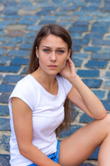 portrait of a beautiful girl outdoors in summer