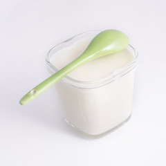 Yogurt in a glass cup, isolated on a white background