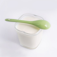 Yogurt in a glass cup, isolated on a white background