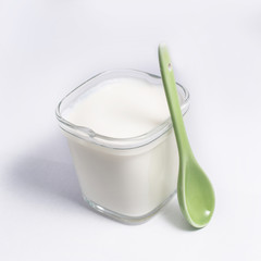 Yogurt in a glass cup, isolated on a white background