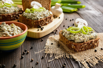 Slice of whole wheat toast with mushroom spread with Roquefort cheese and leek