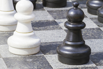 Close up of life sized chess pieces