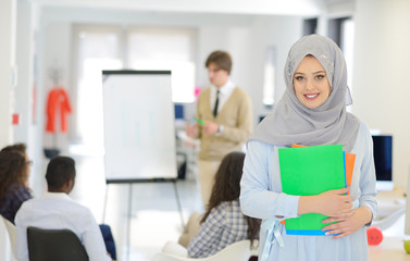 Arabic business woman working in team with her colleagues at startup office