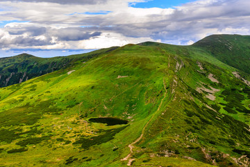 Plakat Carpathian mountains landscape, view from the height, Nesamovyte lake under hill.