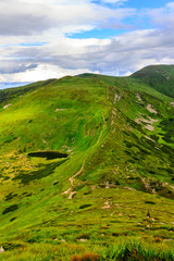 Fototapeta na wymiar Carpathian mountains landscape, view from the height, Nesamovyte lake under hill.