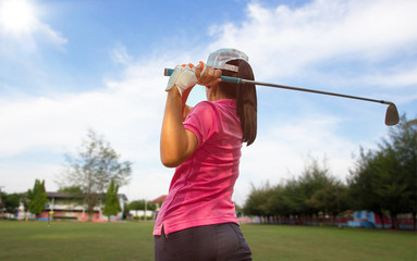 Women player golf swing shot on course in summer sunny - Sports Concept