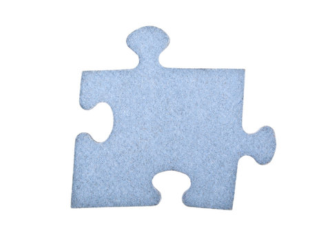 Closeup of jigsaw puzzle piece isolated on white background