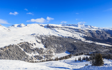 Fototapeta na wymiar Mountains with snow in winter. Ski Resort Laax. Switzerland