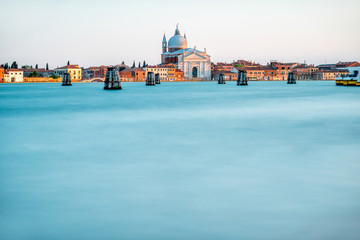 Obraz premium Sunset view on La Giudecca island with basilica del Redentore on the sunset in Venice. General plan with copy space