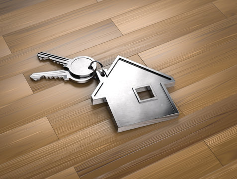 Home keys on wooden background