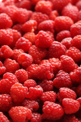 Ripe and sweet red raspberries background