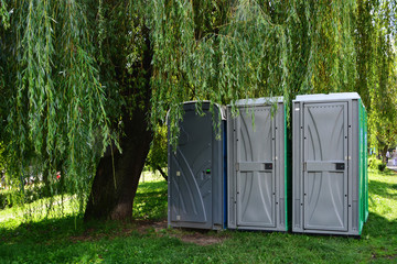 Portable toilets - outdoor portapotty - obrazy, fototapety, plakaty