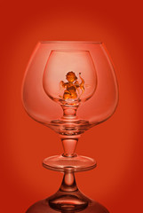 Empty wine glasses on a red background