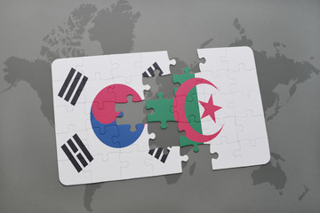 puzzle with the national flag of south korea and algeria on a world map background.