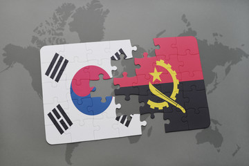 puzzle with the national flag of south korea and angola on a world map background.